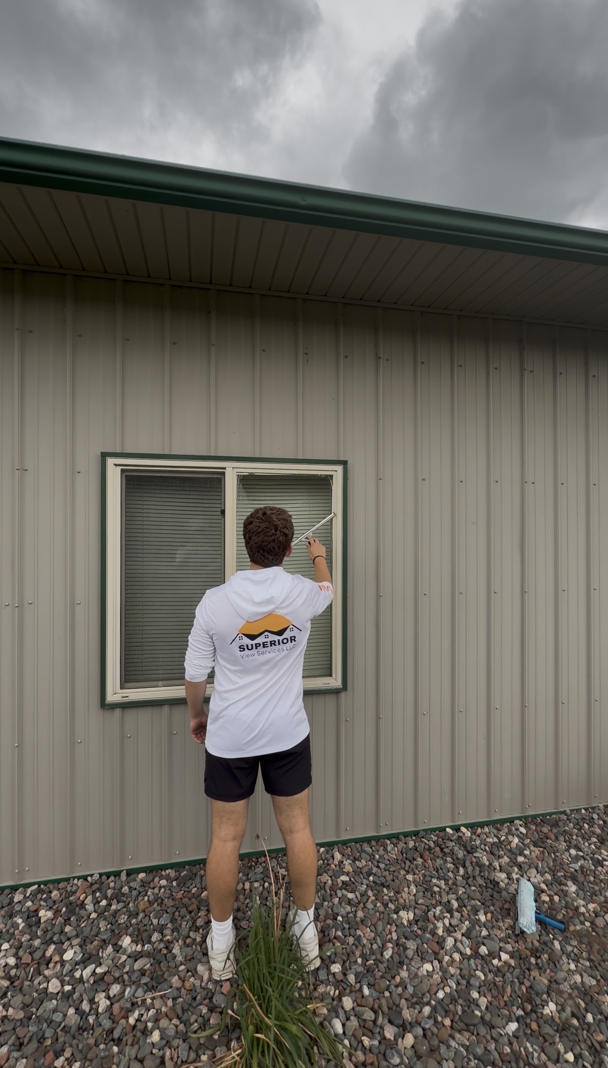 Superior View Services cleaning windows on a local home